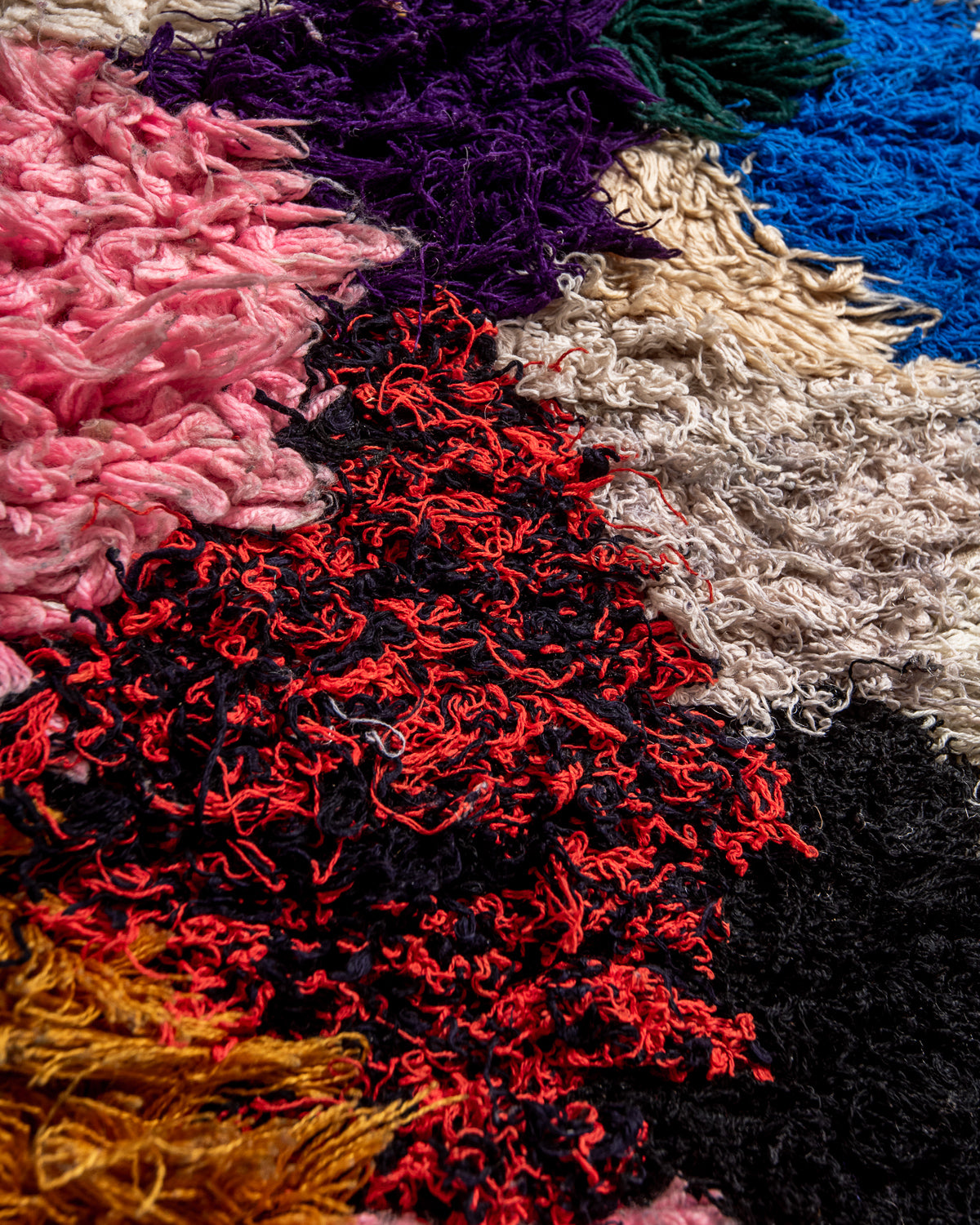 Modern designer vintage handcrafted Berber rug from Morocco. Boucherouite runner rug with beautiful colors and patterns.